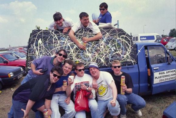 Bonehead, Guigs (bottom left) and gang, with Bonehead's Pollock'd truck at Spike Island, 1989. Credit: Ian Tilton